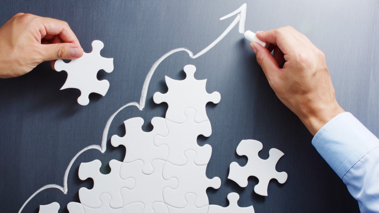 Improvement puzzle pieces, arrow trending upwards