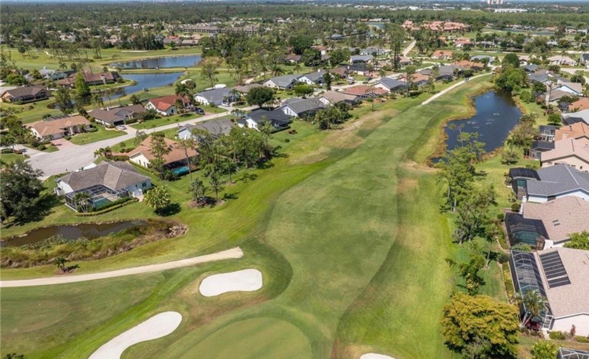 An aerial view showcases the Eagle Ridge golf course in Fort Myers, surrounded by elegant homes that line the pristine fairways and serene lakes, highlighting the beautiful community of Eagle Ridge. This picturesque landscape reflects the desirable living environment and real estate options available in South Fort Myers.