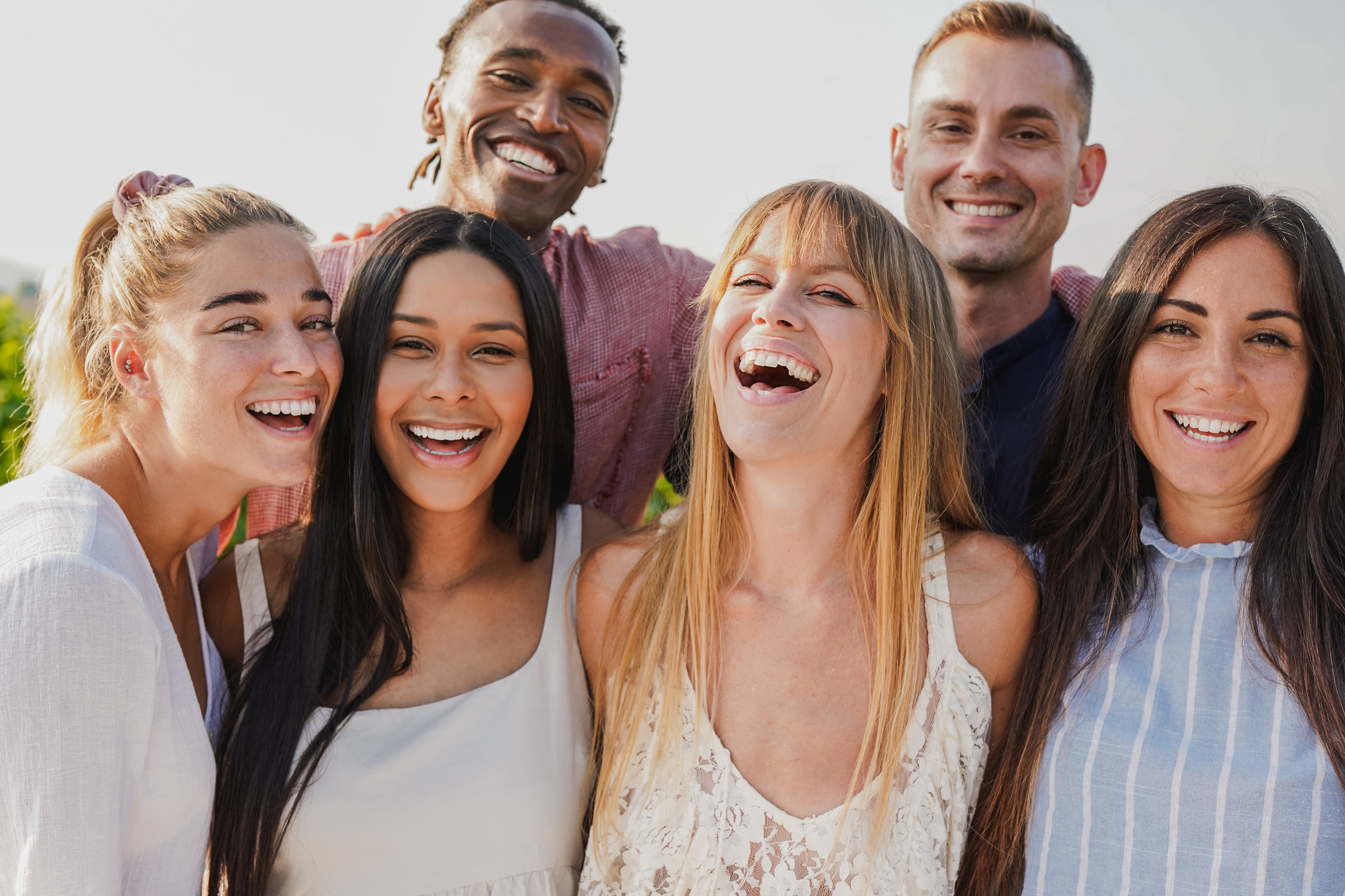 adults smiling after getting dental bone graft for mouth