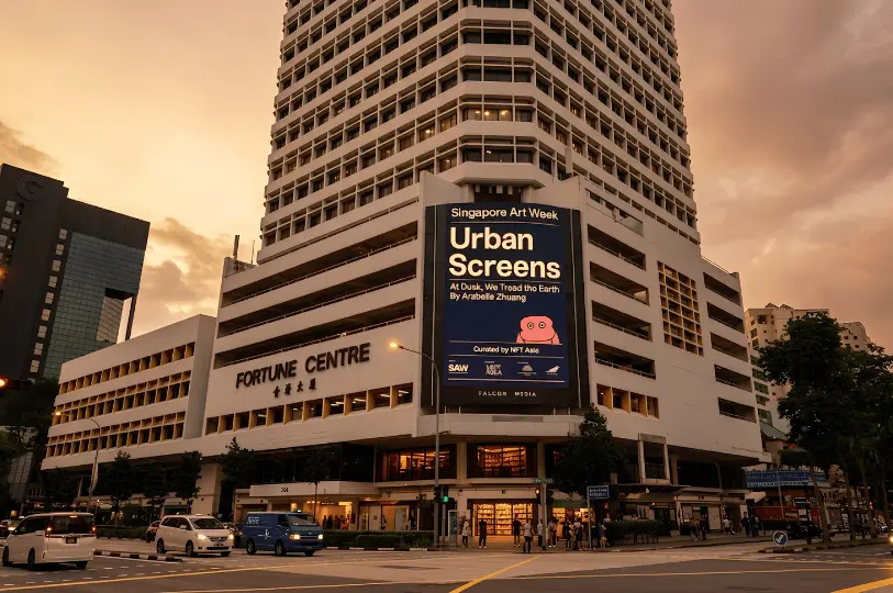 Exterior view of the Fortune Centre building at dusk, featuring a large digital billboard advertising Singapore Art Week and the building's name above the entrance.