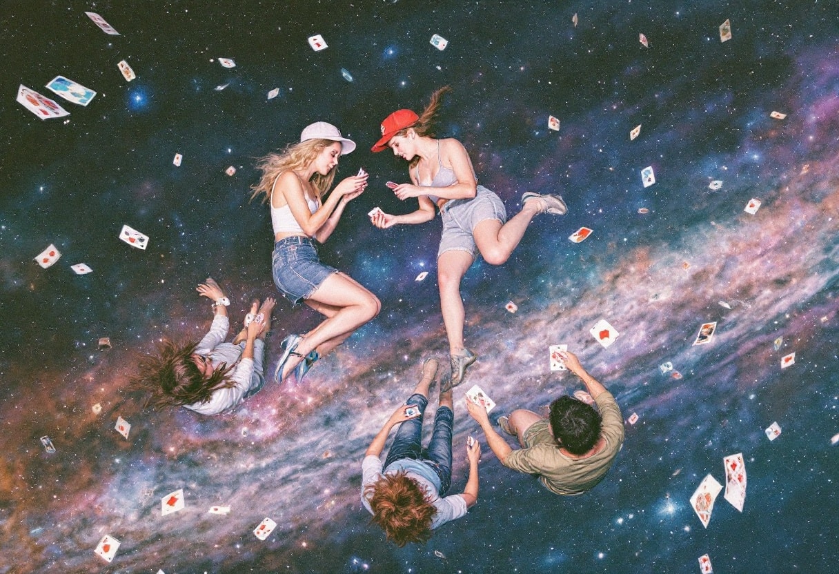 A group of people floating in space playing cards