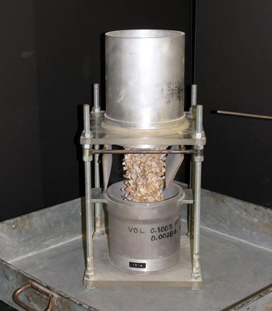 A jar filled with a coarse aggregate sample