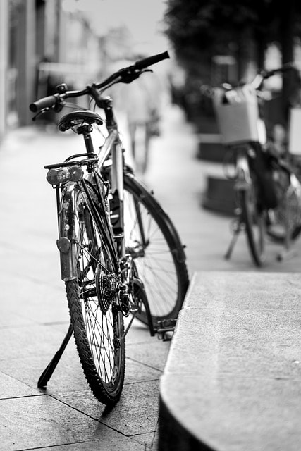 A black and white image of a bike.
