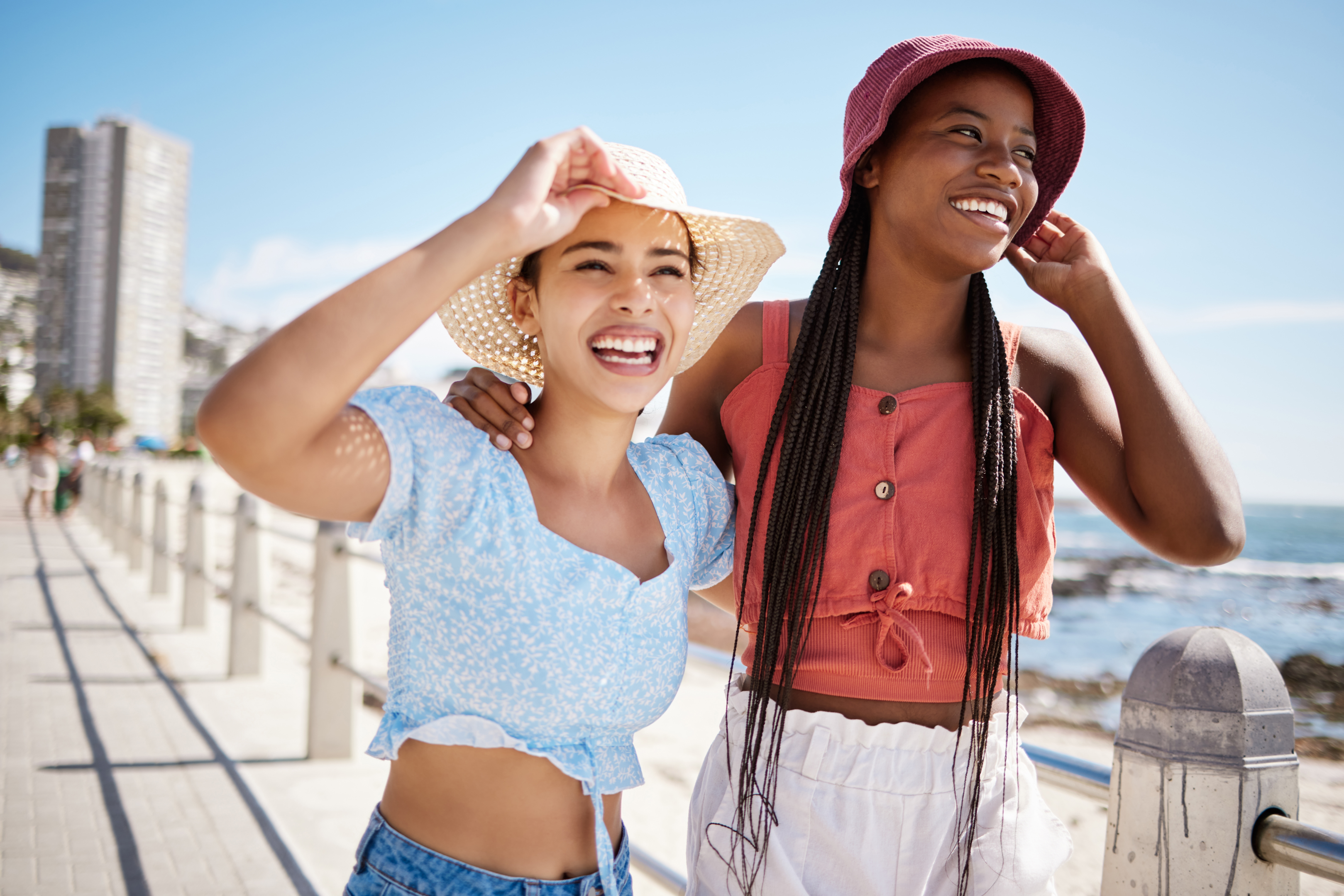 Joyful lesbian couple celebrating their strengthened bond after undergoing couples therapy at Loving at Your Best Marriage and Couples Counseling.