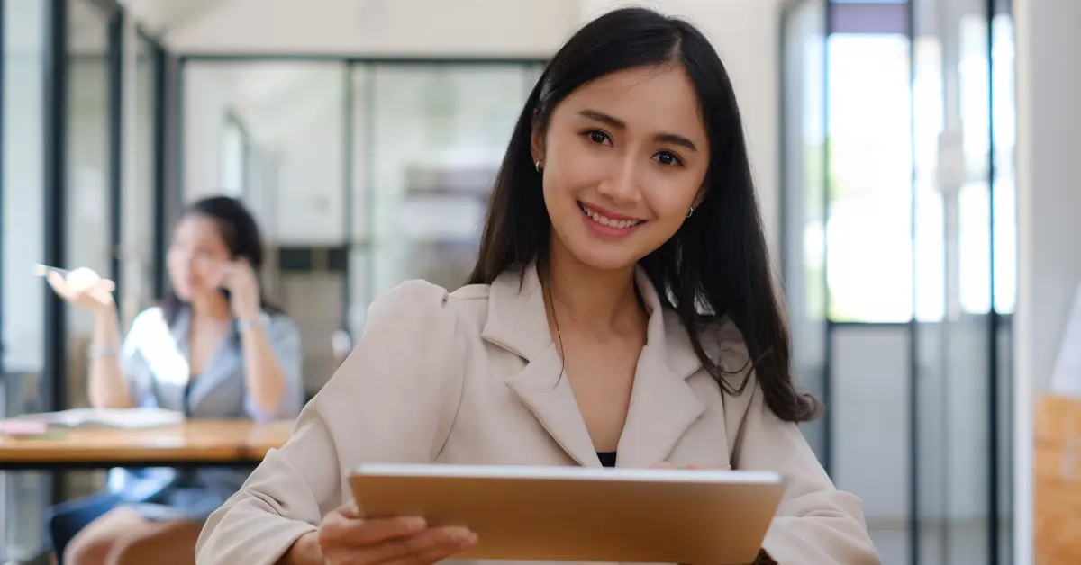 A woman studying her earnings report to analyze the OnlyFans percentage cut.