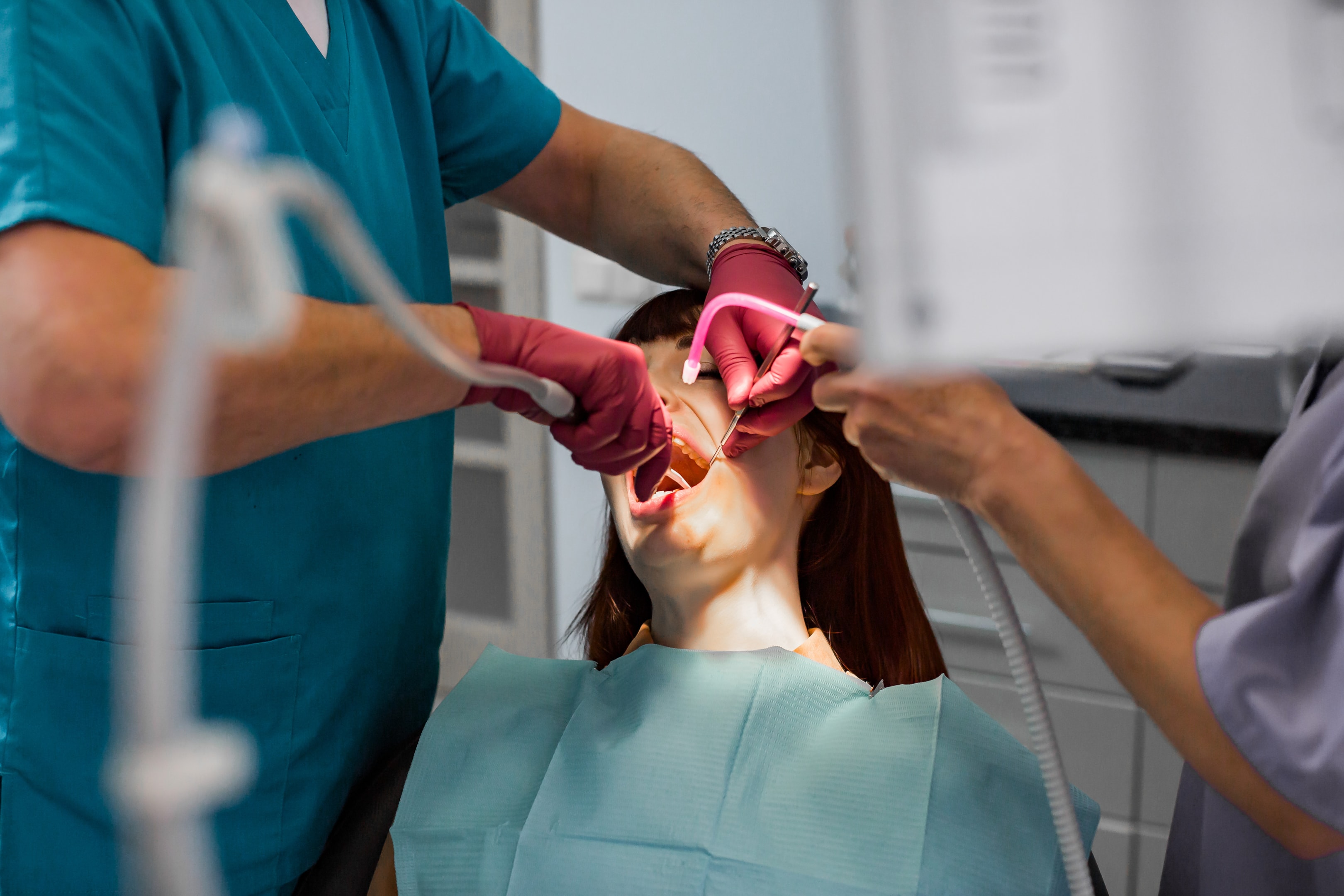 A photo of a woman during her anesthesia before wisdom tooth extraction.