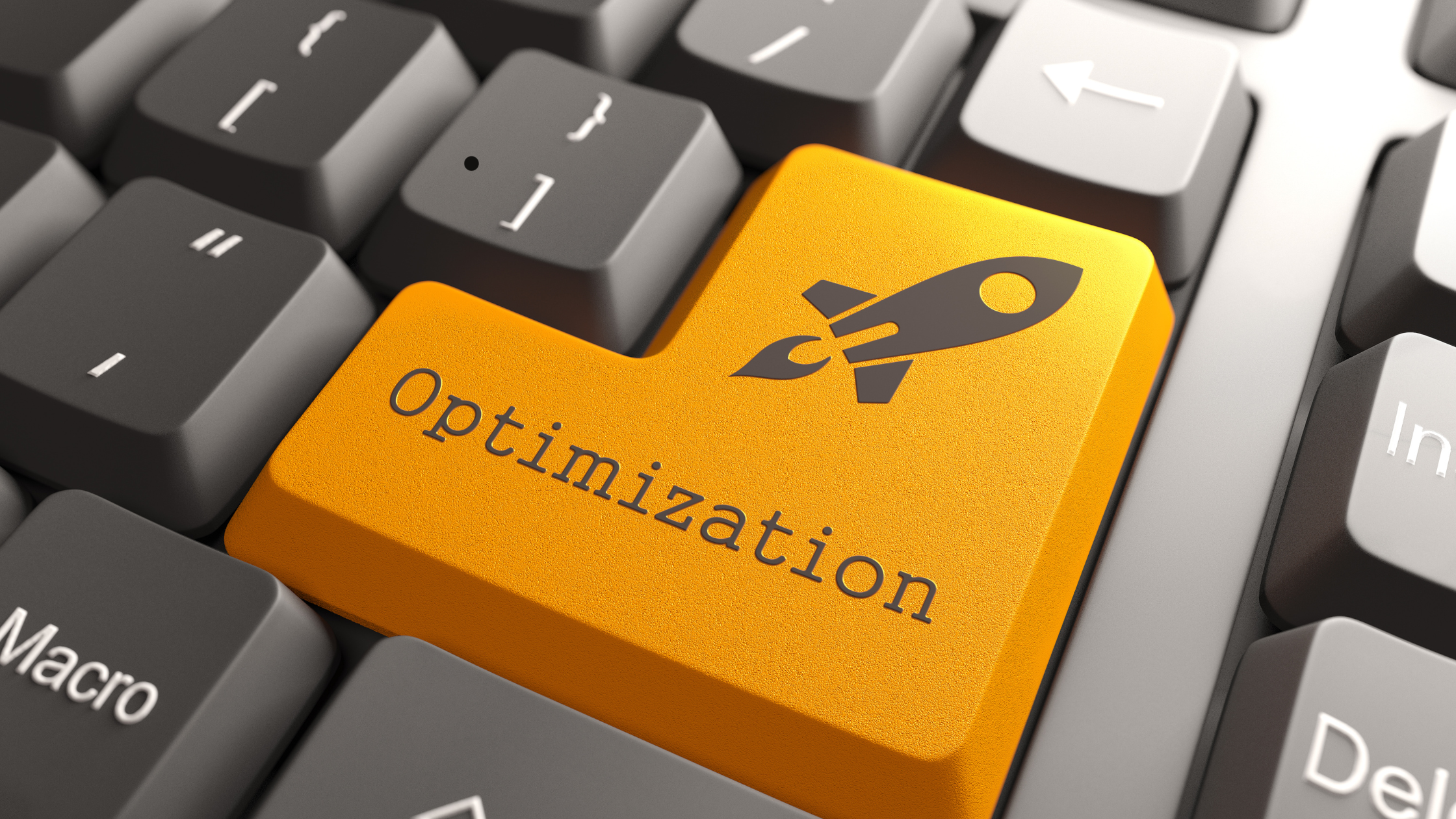 Orange keyboard key labeled "Optimization" with a rocket icon, symbolizing ongoing optimization services, usage tracking, and telecom expense management.