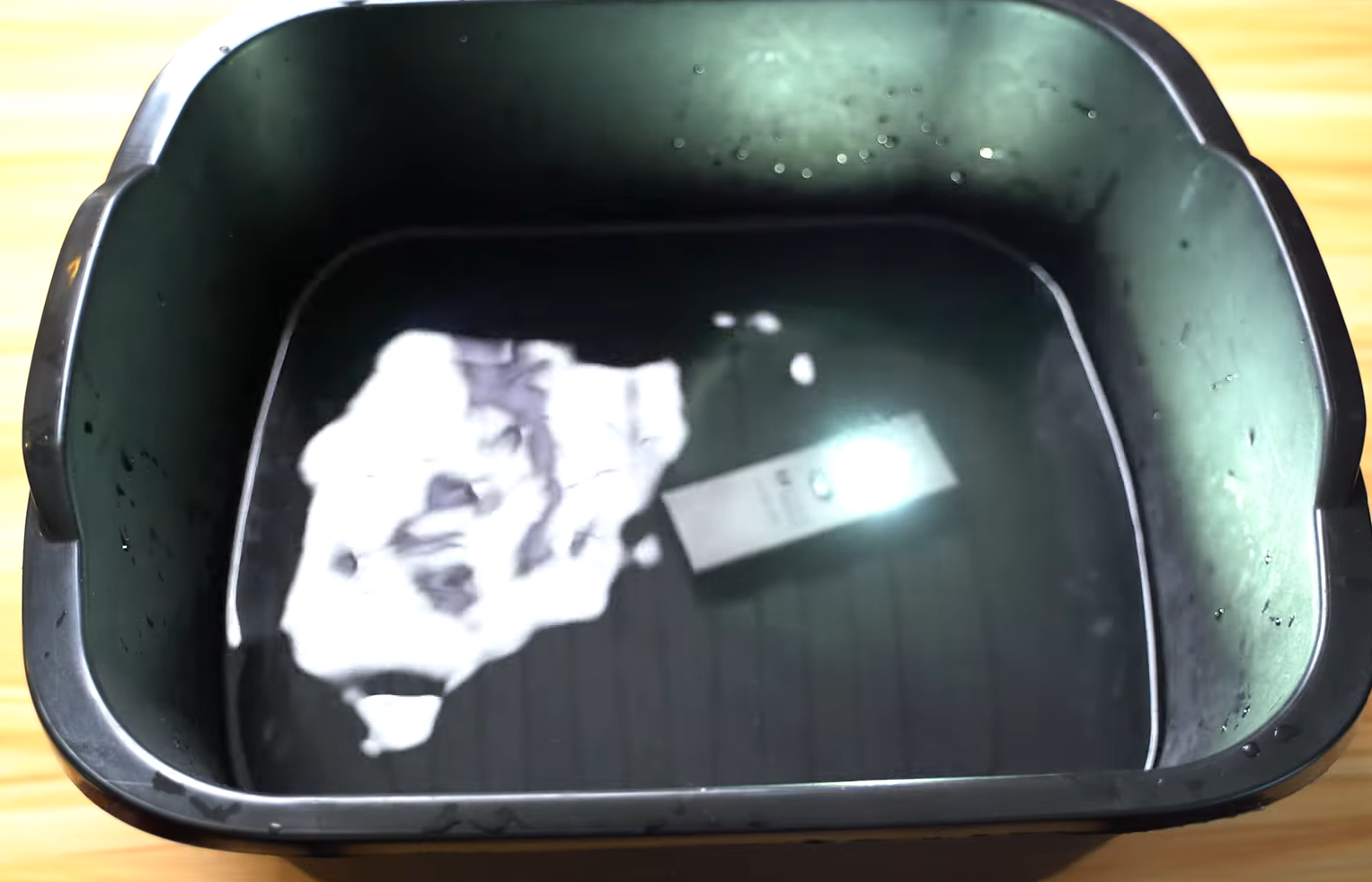 Cybertools tactical pocket flash light dunked in a bowl of water