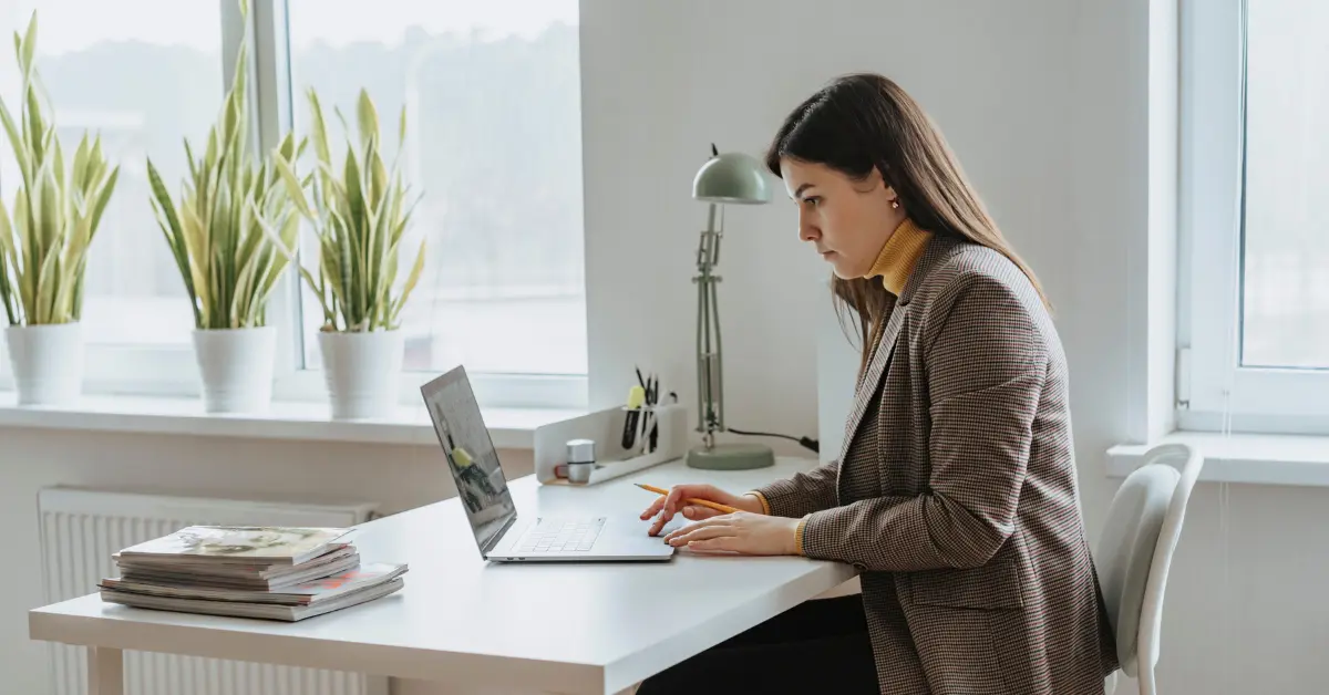 A woman learning about home office deduction for her OnlyFans taxes.