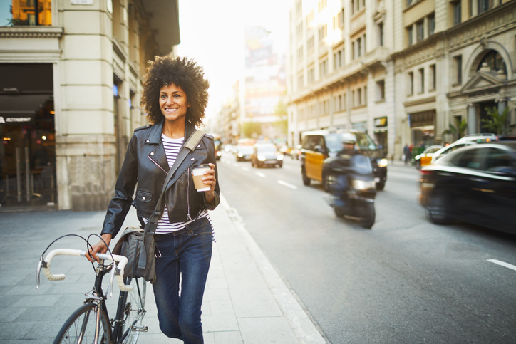 Young woman in the streets of Barcelona commuting.