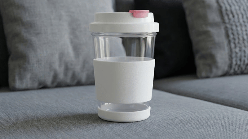 A plastic water cup with a silicone protective case on the outside.