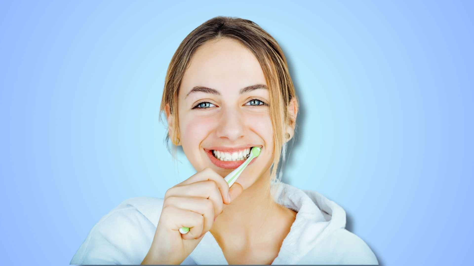 A woman brushing her teeth