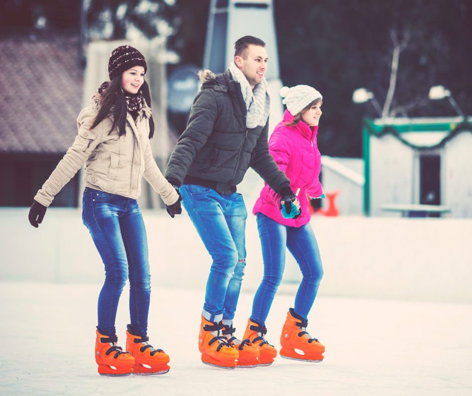 A group of friends ice skating together