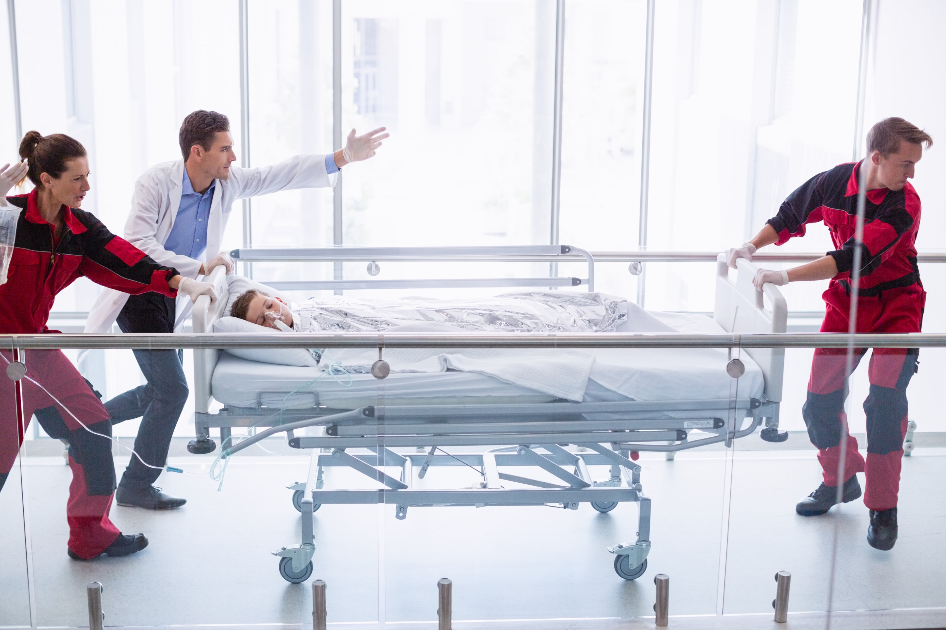  Doctors pushing the emergency stretcher