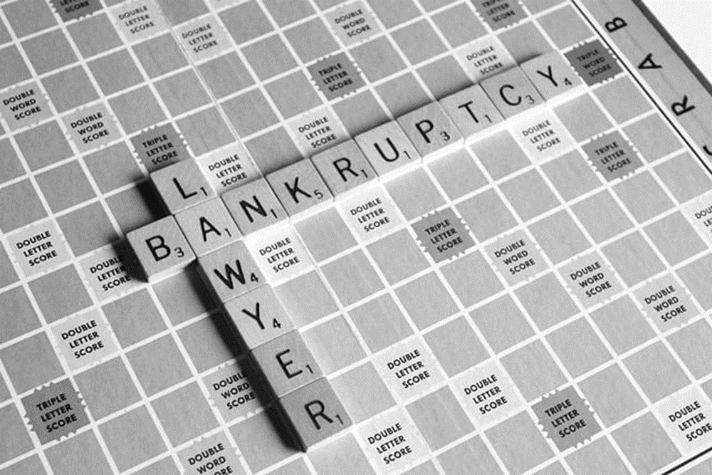 In a Georgia bankruptcy court, a debtor consults with their attorney to understand the implications of their case.