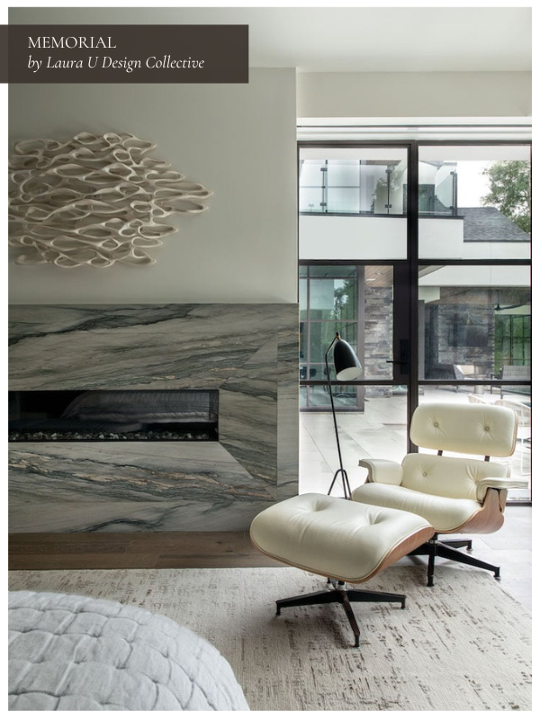 painterly marble veining on a fireplace with a cream-colored Eames lounge chair