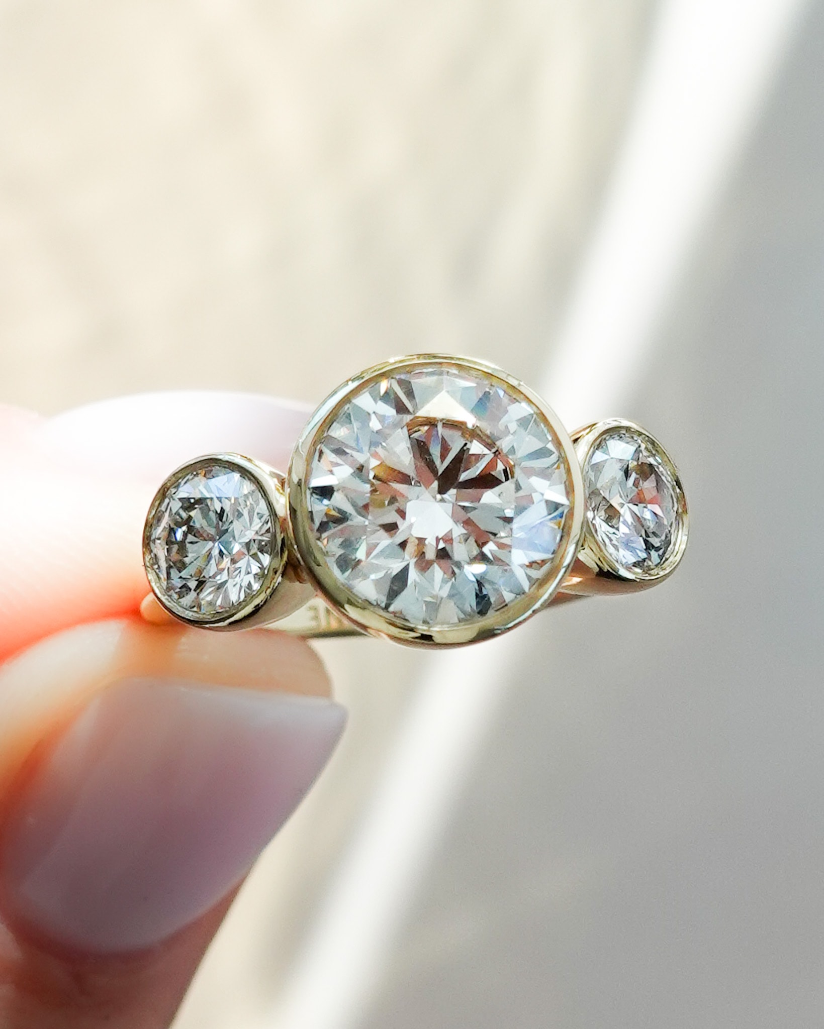 Penumbra Bezel Triad with Petite Round Cut Diamonds