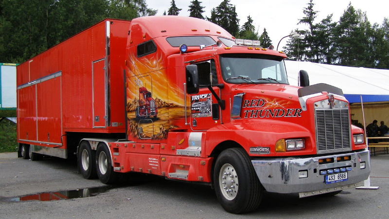 a red truck with advertising wrap