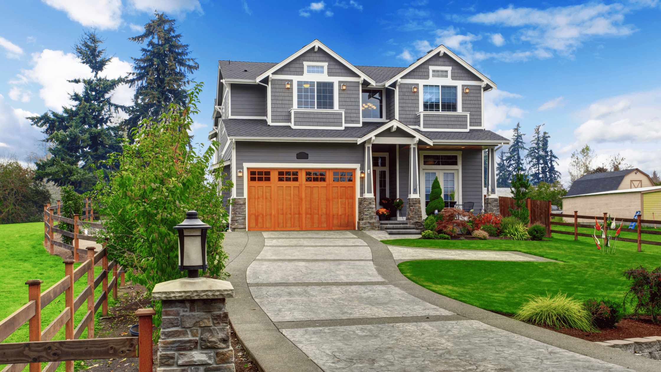 A well-maintained house with a freshly painted exterior, manicured lawn, and tidy entryway showcasing strong curb appeal, reducing tenant maintenance requests.