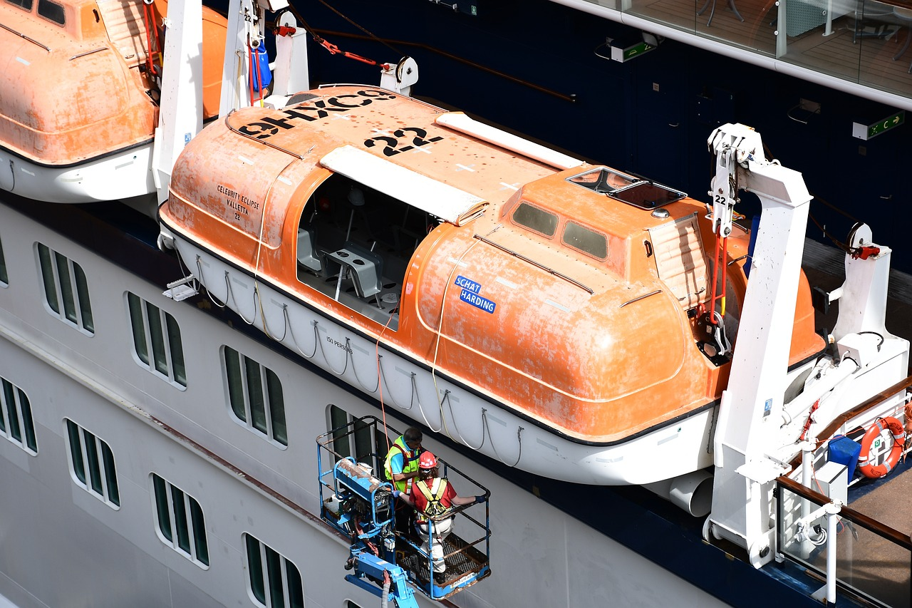 Partially enclosed lifeboat with canopies open