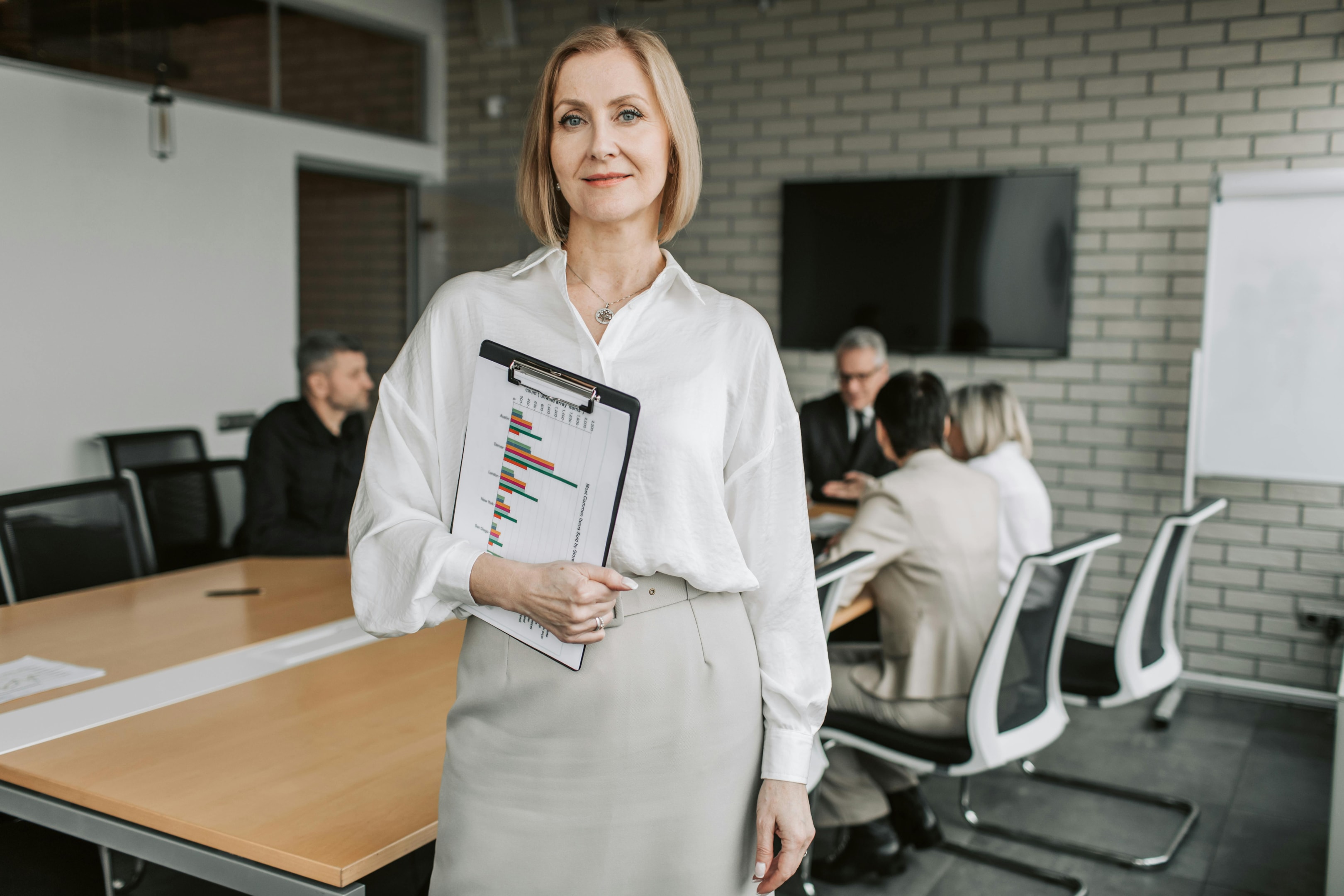 Real estate investor holds reports about her various properties, including those out of state.