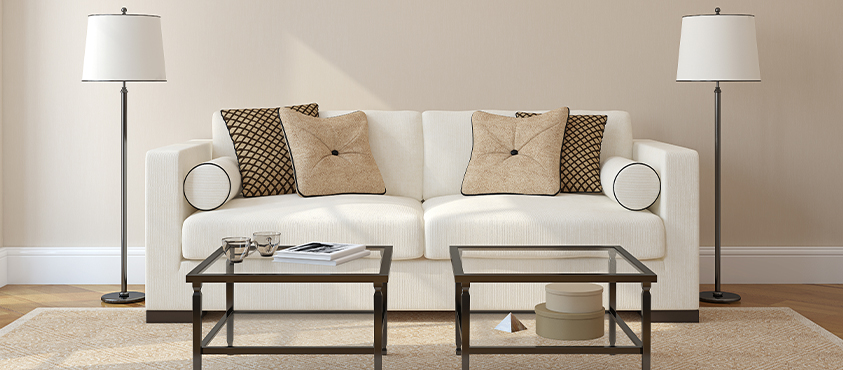 Symmetry is one way to create an appealing design. This couch is perfectly symmetrical, with three well proportioned decorative cushions on each side: two square and one bolster.