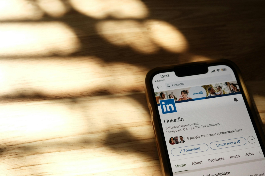 LinkedIn company profile page displayed on a smartphone, highlighting LinkedIn as a tool for Philippines hiring.