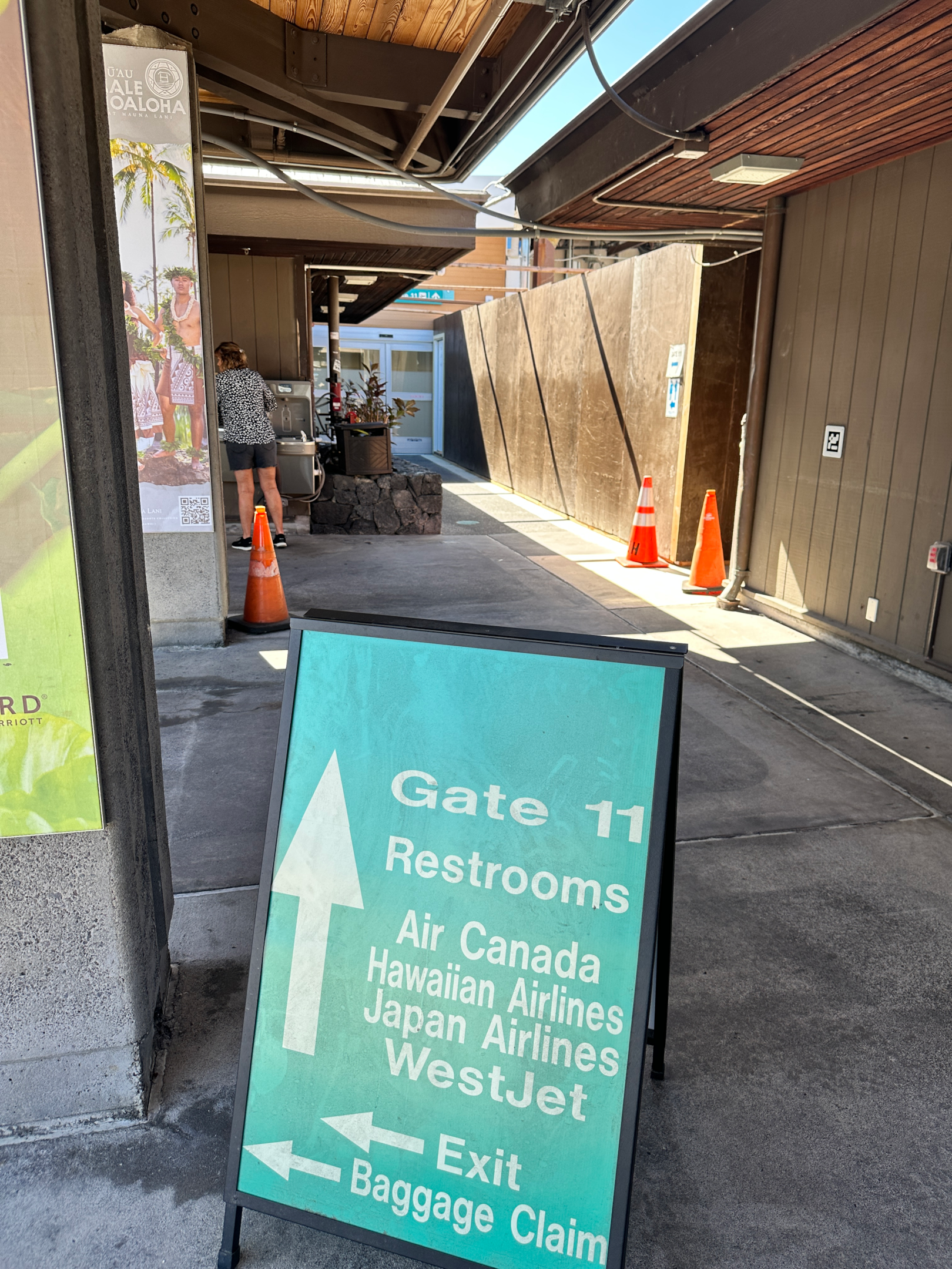 Gate 11 bathroom sign at the Kona International Airport