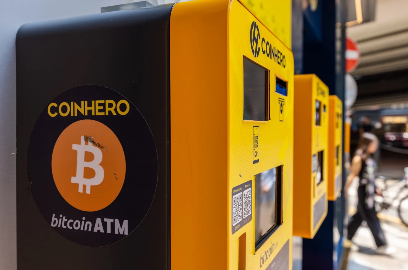 An image of a Bitcoin ATM highlighting Bitcoin as an asset class.