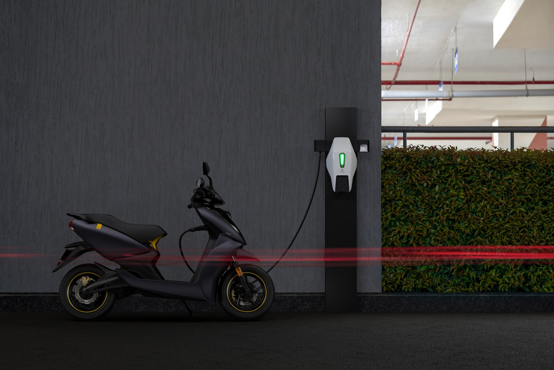 EV charging cable plugged into a scooter.