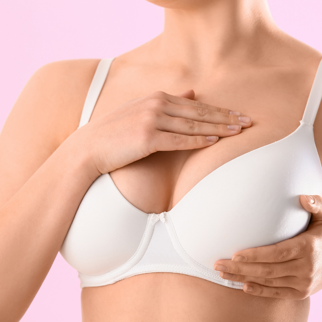 woman sizing one side of breast - bra fit solutions for asymmetric breasts
