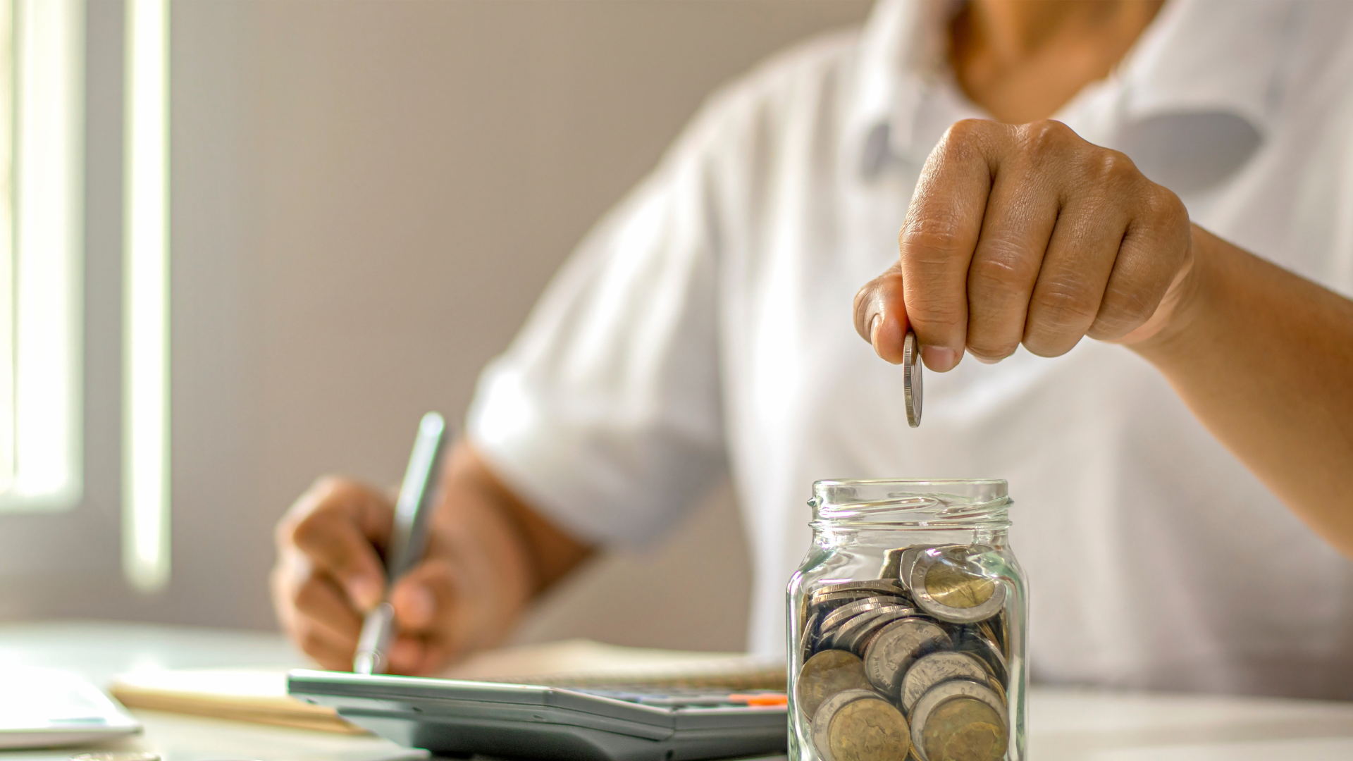 A person looking at a chart of investment costs