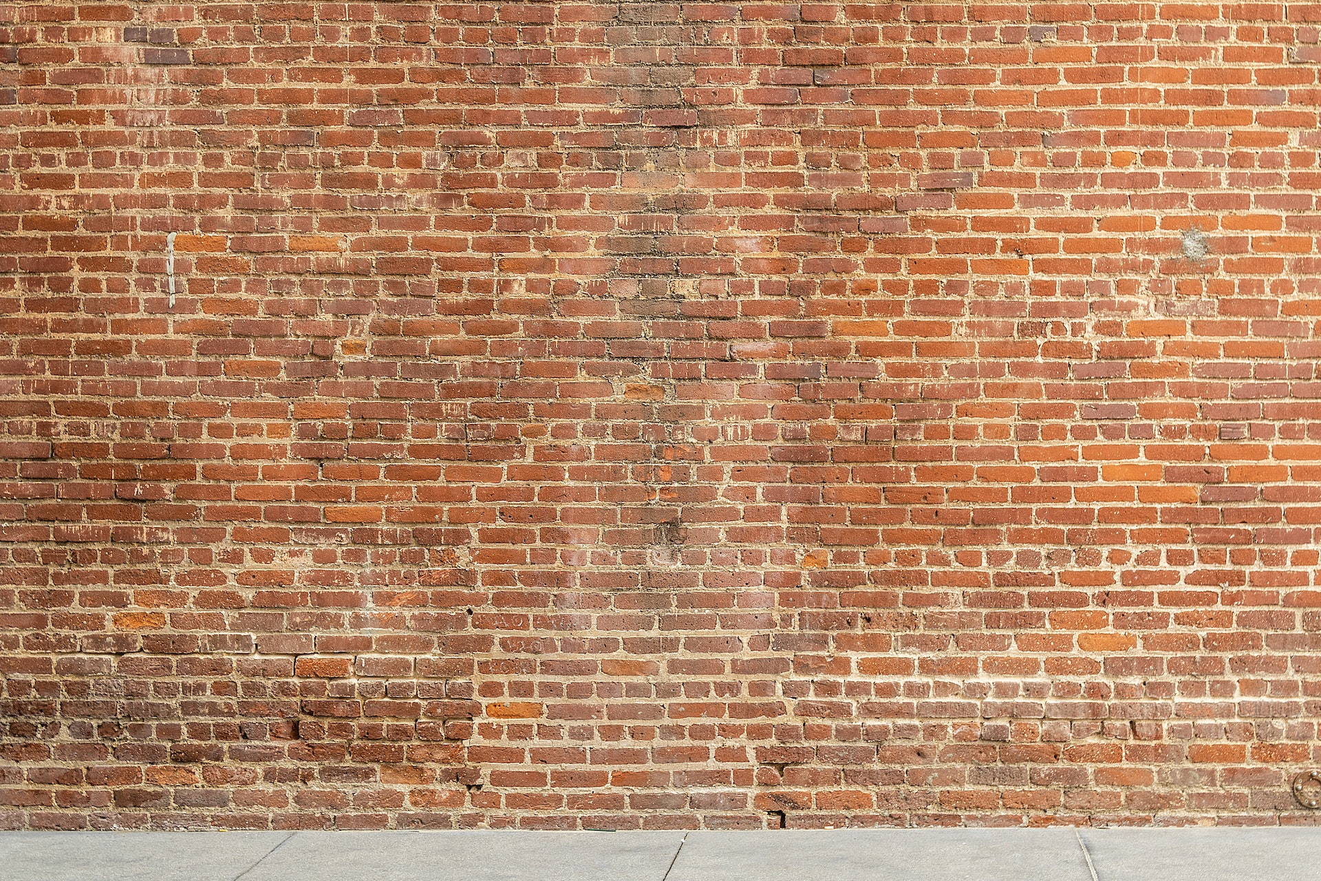 Image of a brick wall with spalling bricks