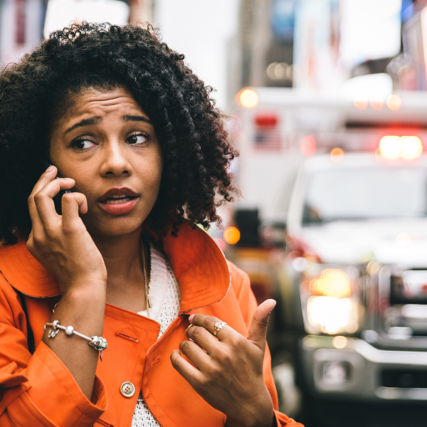An image showing a person calling 911 from a safe location.
