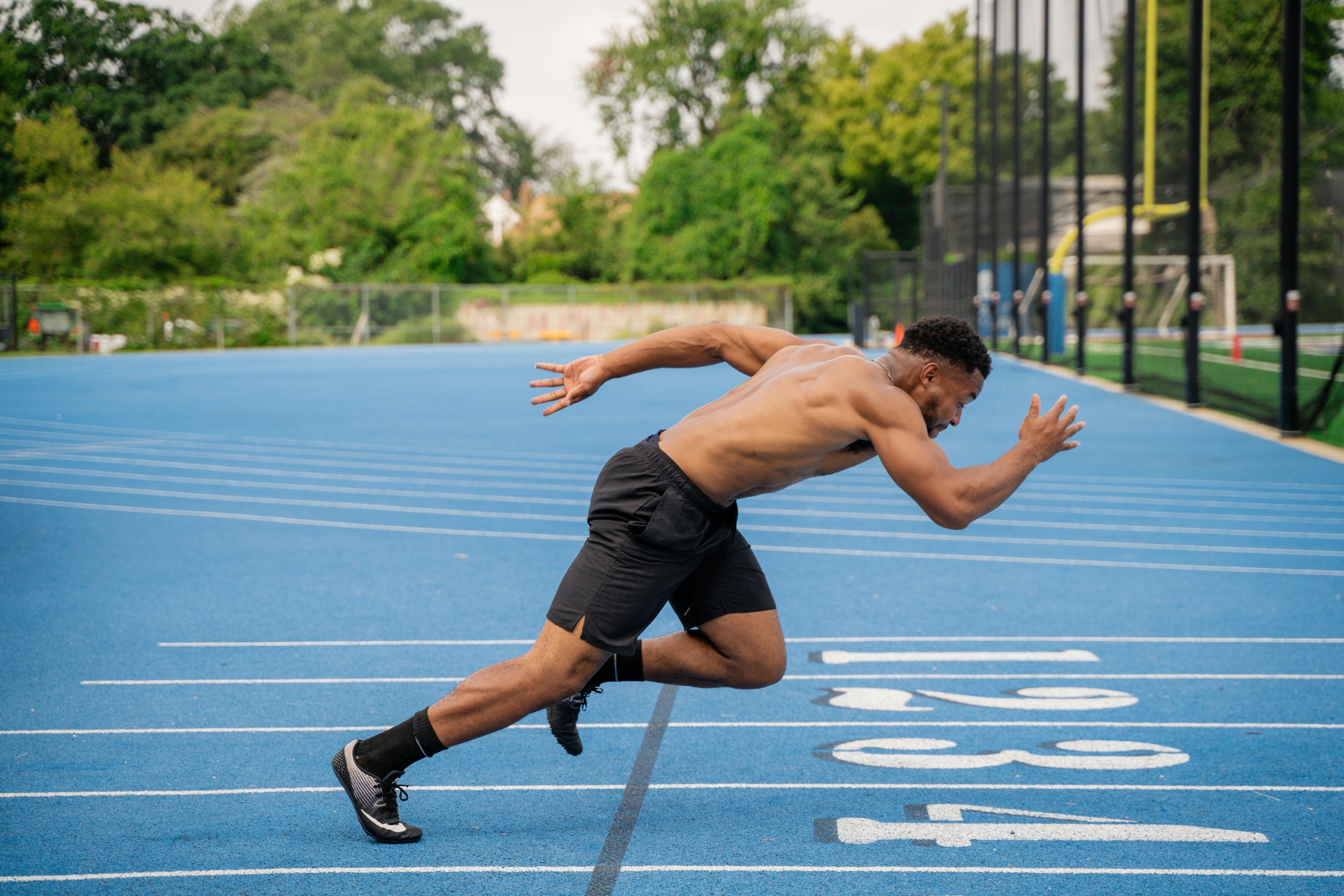 When you don't have proper balance, you might explode on your sprint with your feet turned awkwardly. Start your sprints with your feet shoulder width apart, then explode forward. Be very mindful of your form and see where you're lacking. Photo by Pexels User: https://www.pexels.com/photo/a-man-running-on-a-track-with-a-blue-background-27948294/