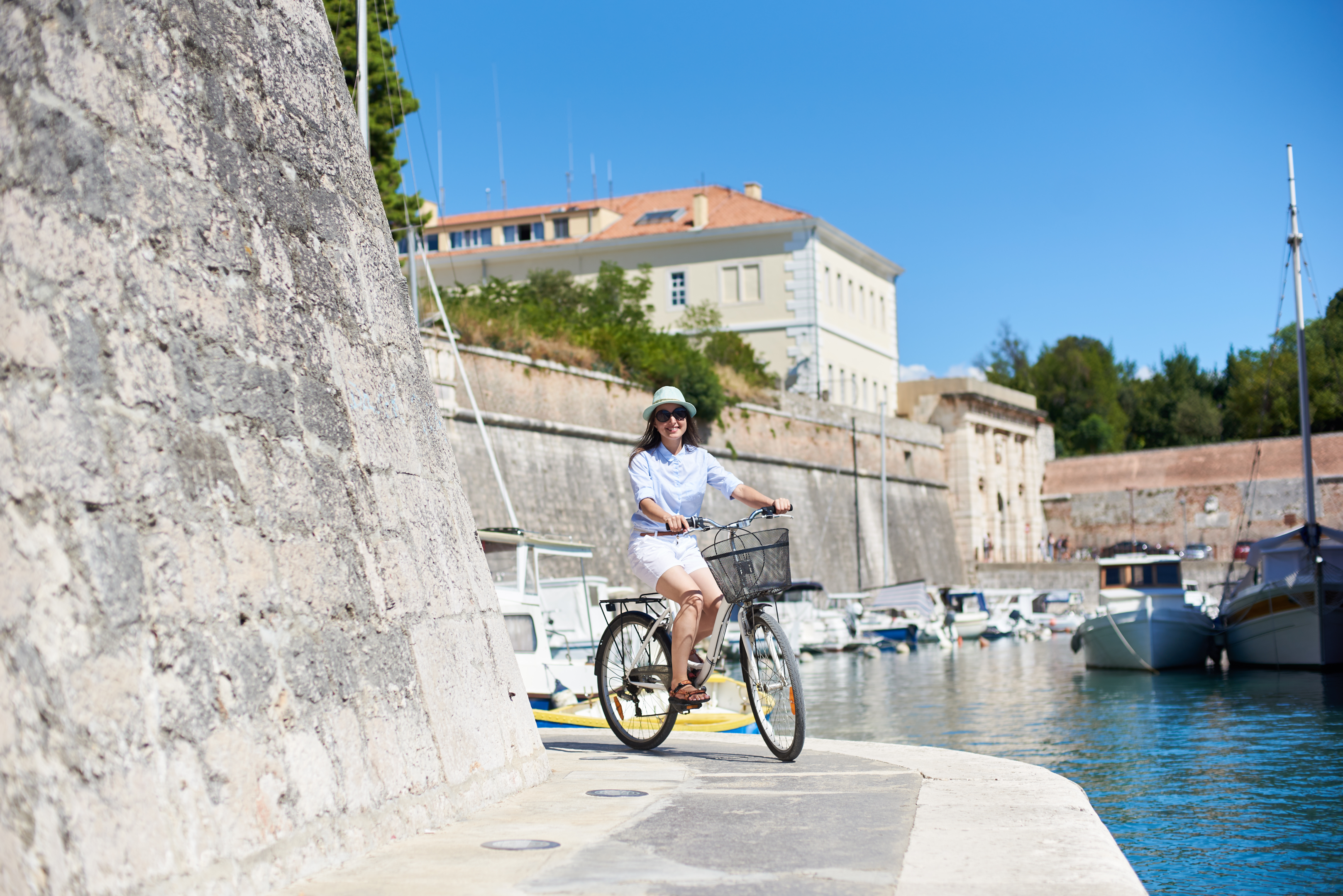 Riding a bike around Zadar city walls. 