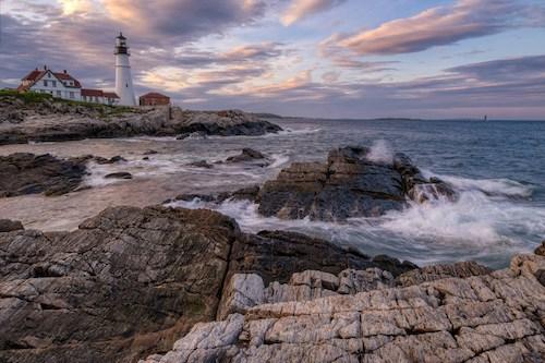 Waves crashing in front of the Portland Head Lighthouse