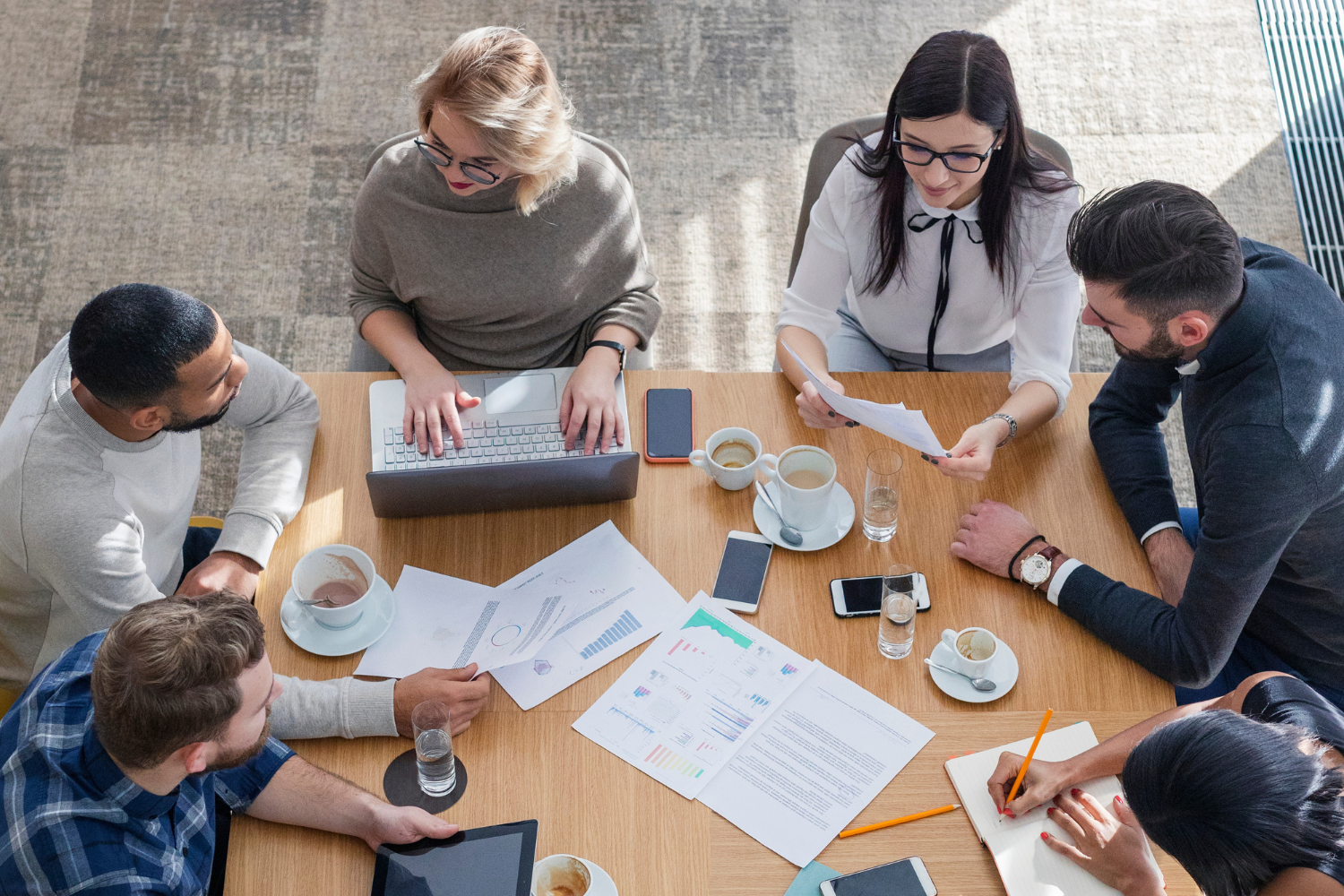 A team of Western managers working on PIP document.