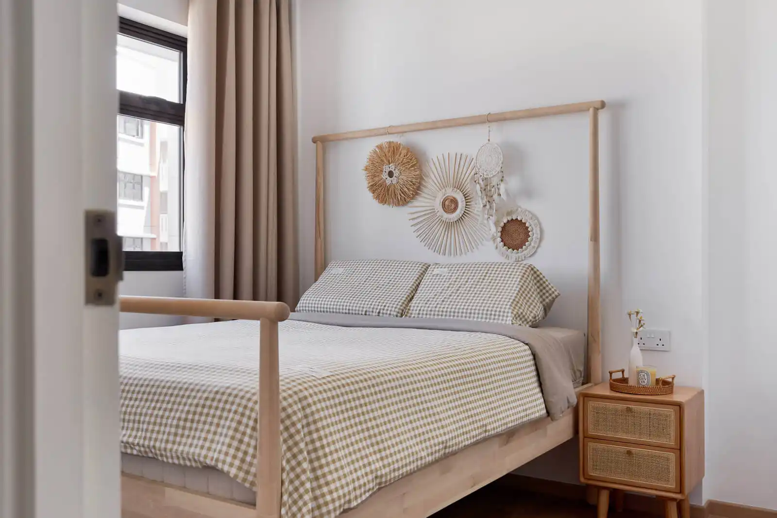 Bohemian platform storage bed with rattan accents – bed ideas for small rooms in Kuala Lumpur.