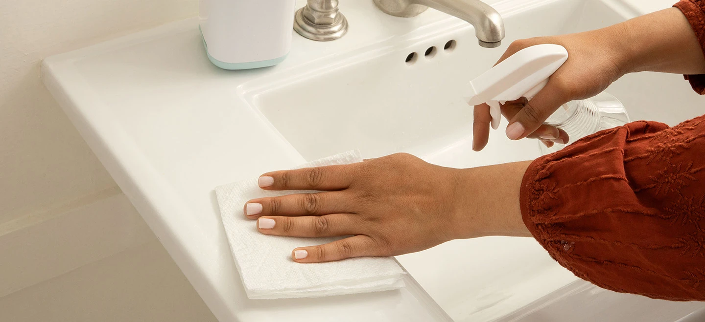 Wipe down the bathroom counters and surfaces