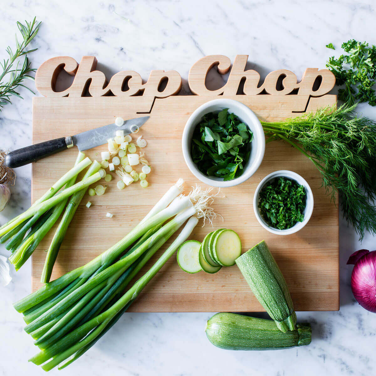 Wooden cutting board - with the words Chop Chop cut out of the top