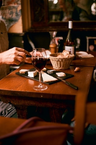 Patrons enjoying a charcuterie board before a meal with a well-guarded secret recipe