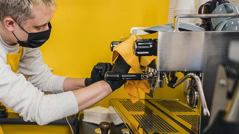 Microfiber towel on a stainless steel espresso machine