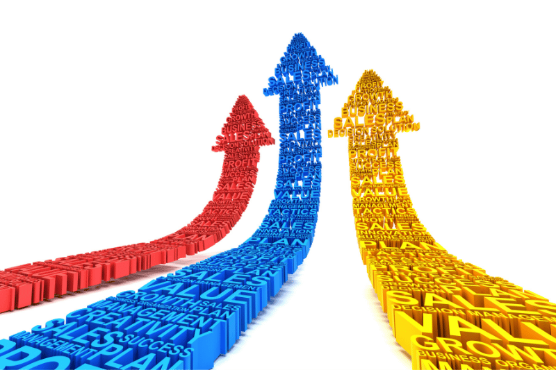 Three upward-pointing arrows made of business-related words in red, blue, and yellow, representing improvements