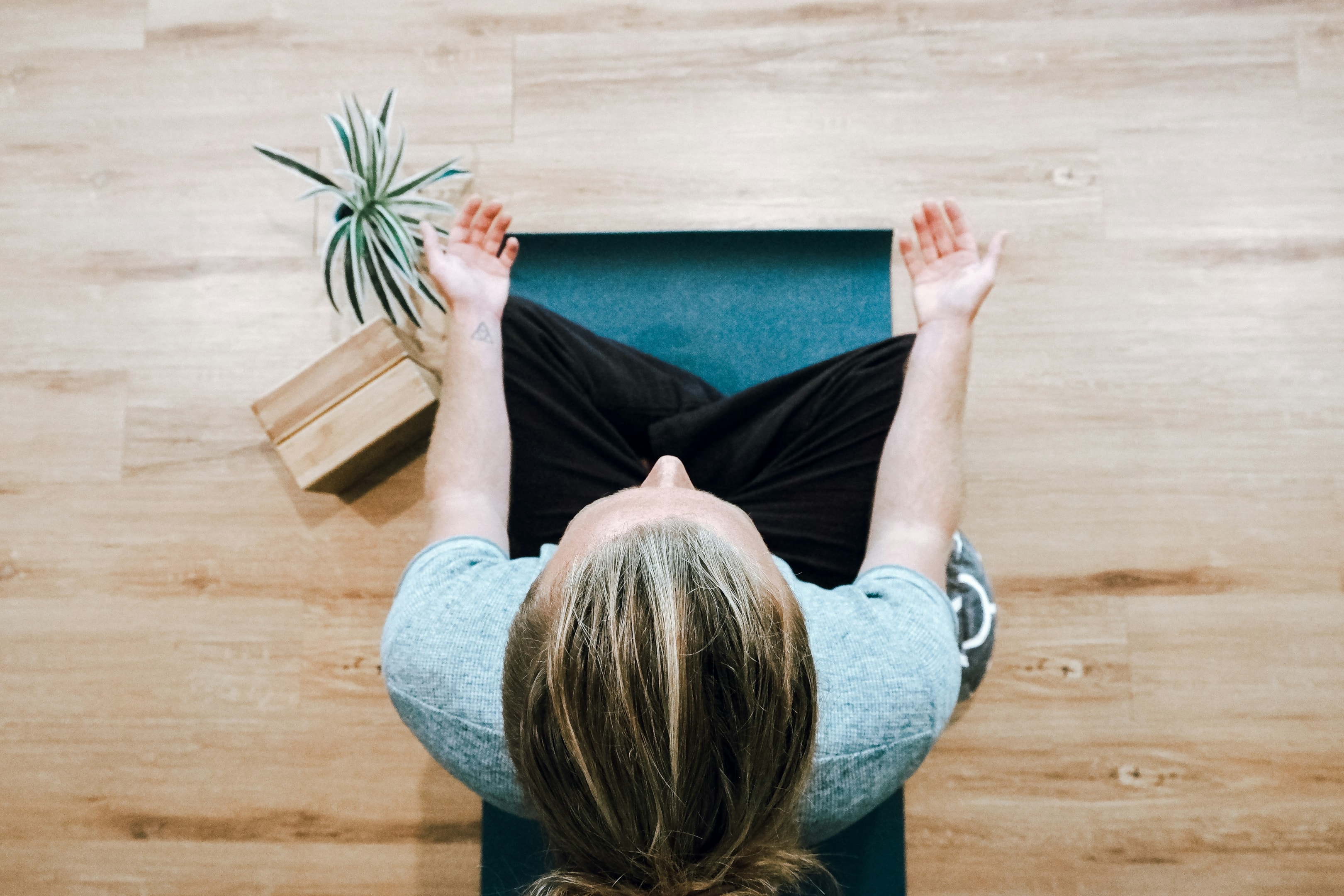 Woman meditating in a seated posture in a calm setting