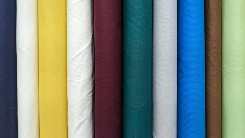 Several different colors of Pima fabric in a row