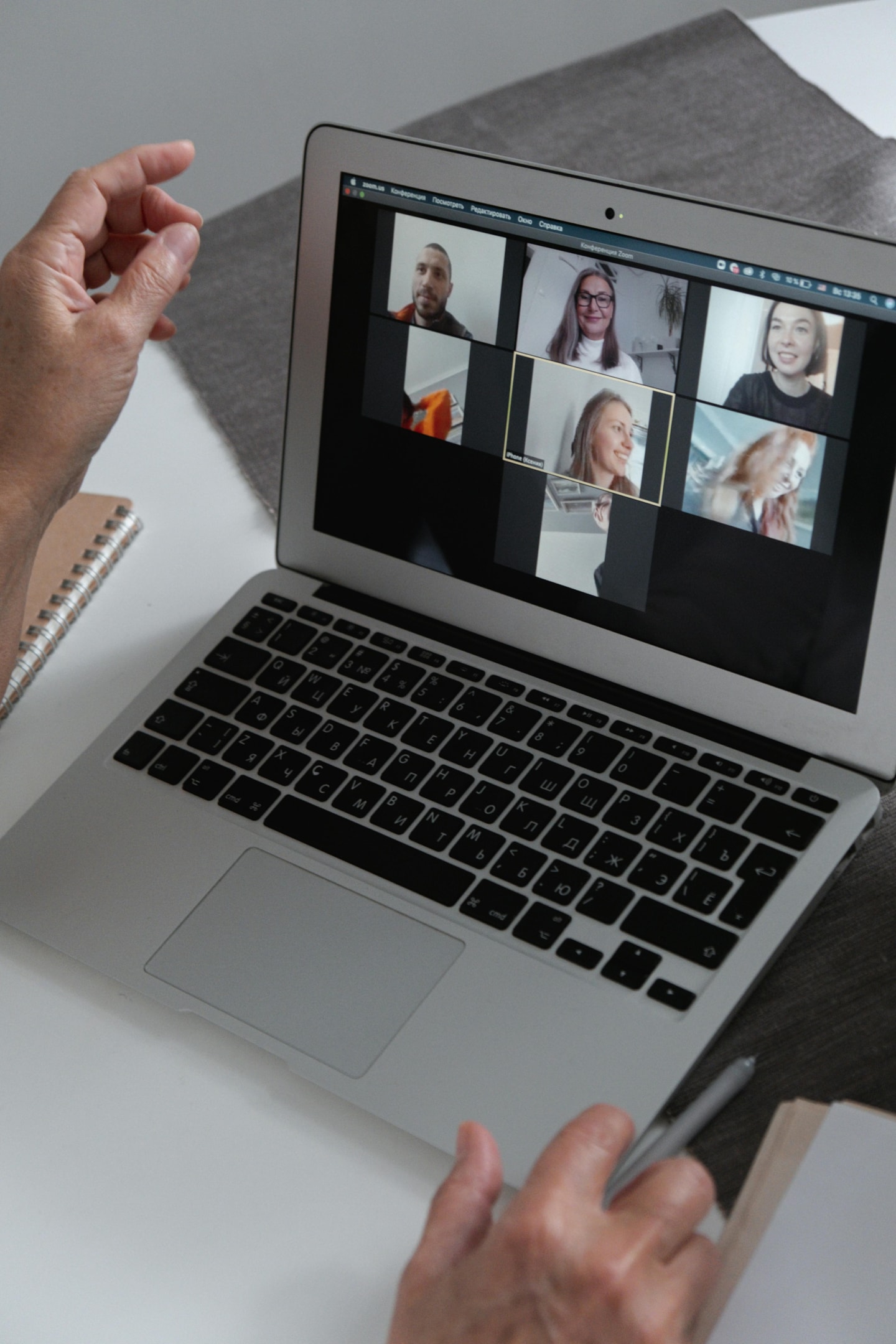 Real estate agent attends virtual networking event. 