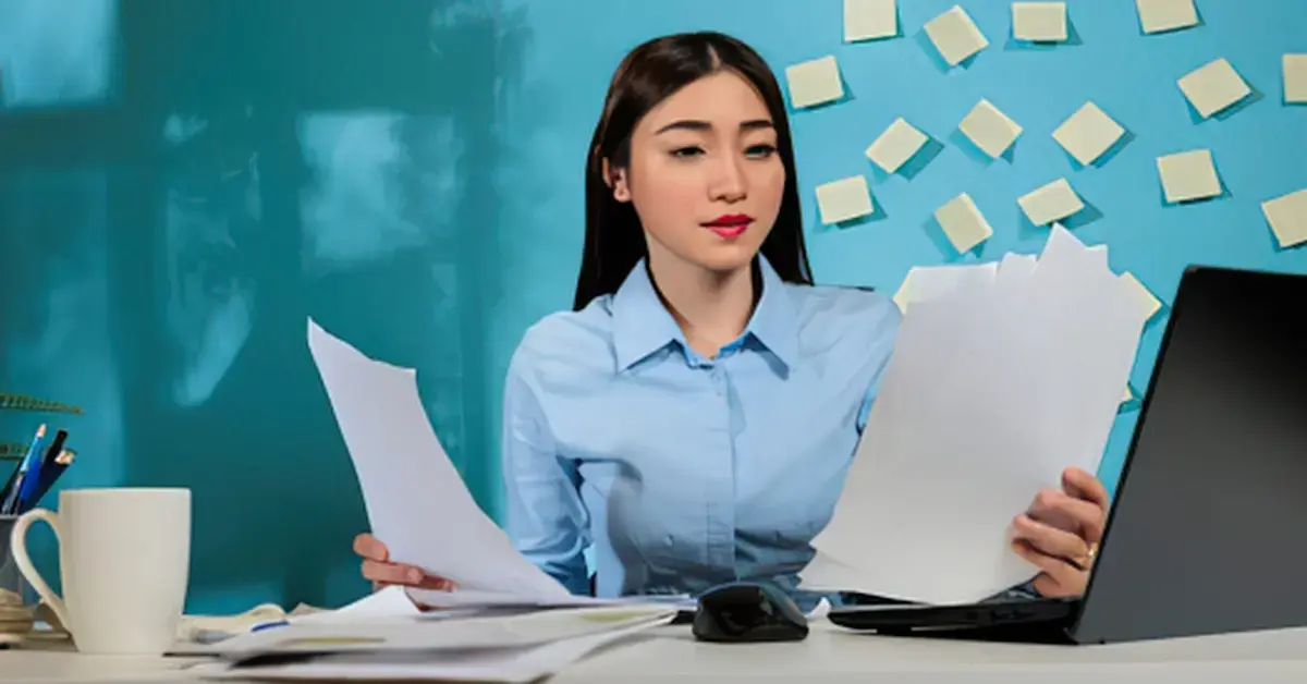 Woman reviewing an IRS notice and Form 9423 for an appeal of IRS collection actions.