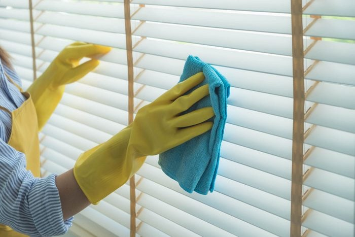 To spot-clean blinds, use a damp cloth to remove dust and dirt