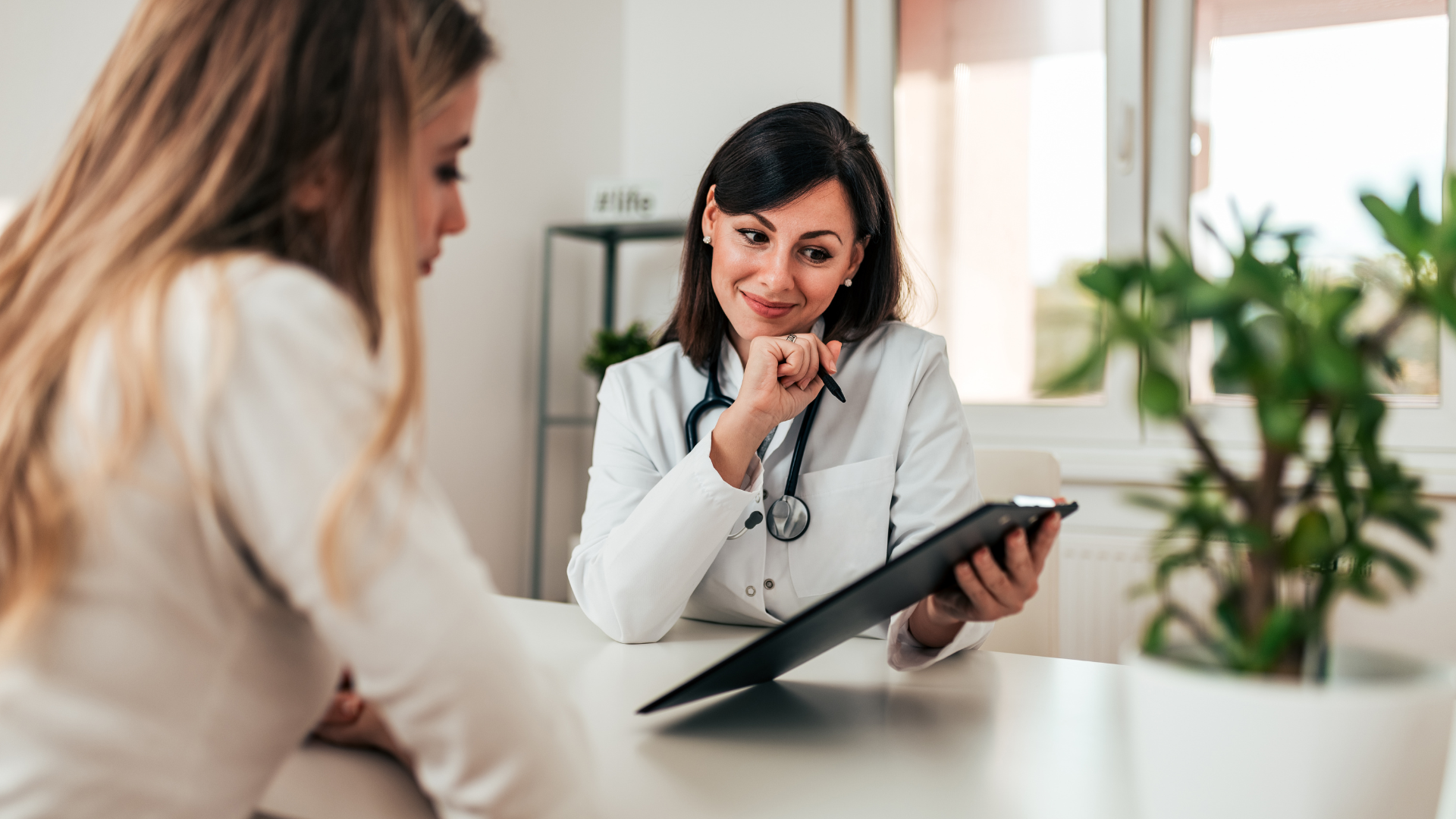 woman consults with her doctor before starting a martial arts exercise program